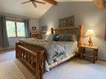 2nd bedroom features king log bed